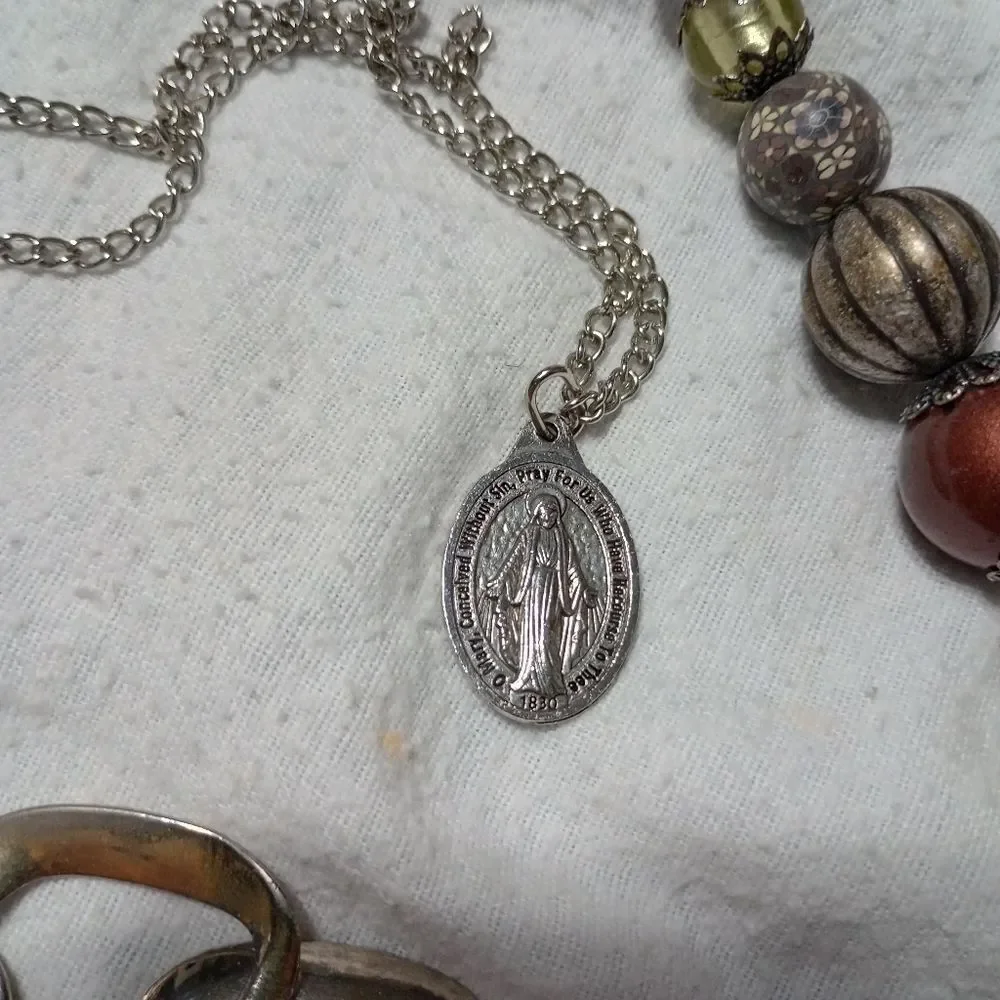 Lot of three quality costume necklaces, one is the Virgin Mary (C022)